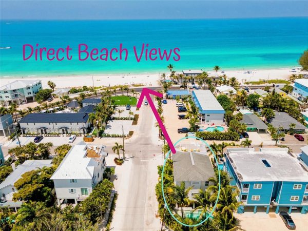 Aerial view of a beachside neighborhood with turquoise ocean; bold pink text 'Direct Beach Views' across the sky.